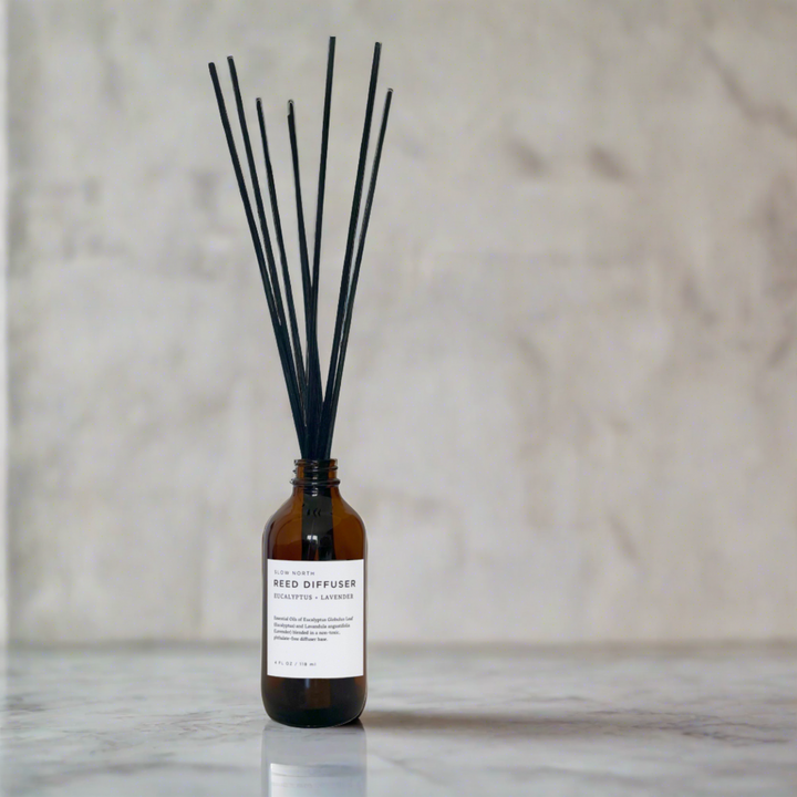 Handcrafted eucalyptus lavender reed diffuser with natural rattan reeds in clear glass vessel for home aromatherapy