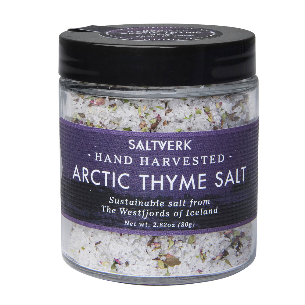 Jar of Saltverk Arctic Thyme Salt, sustainably hand-harvested from Iceland's Westfjords, featuring a purple label and white salt blend.