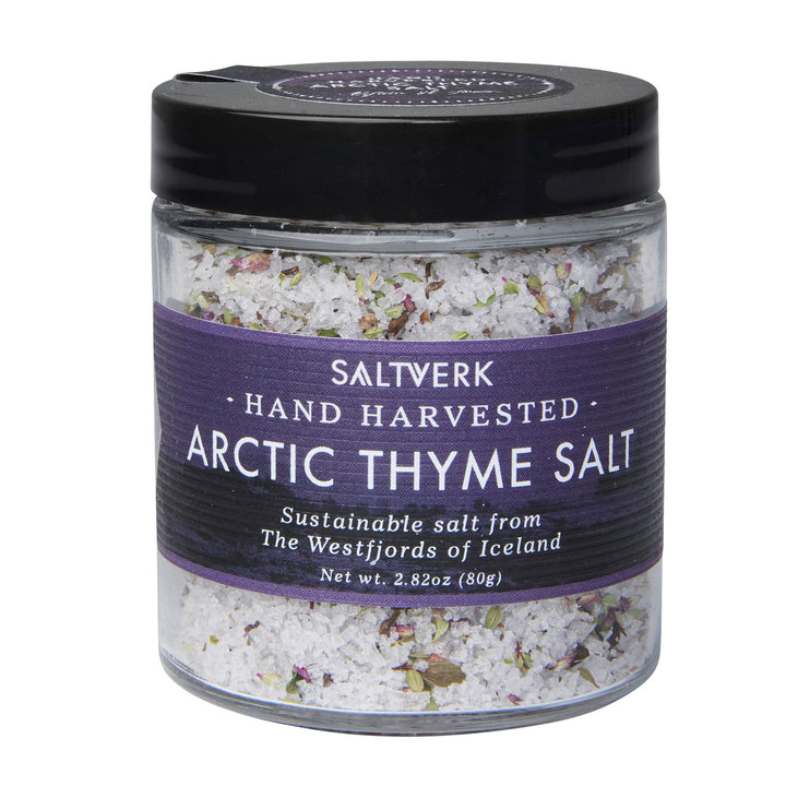 Jar of Saltverk Arctic Thyme Salt, sustainably hand-harvested from Iceland's Westfjords, featuring a purple label and white salt blend.