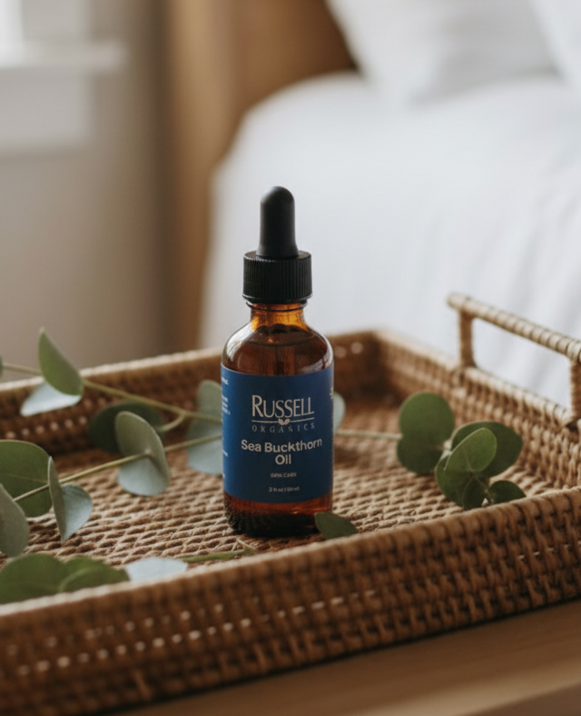 Sea Buckthorn Oil bottle on wicker tray included in the Sunrise Ritual: Morning Routine Kit