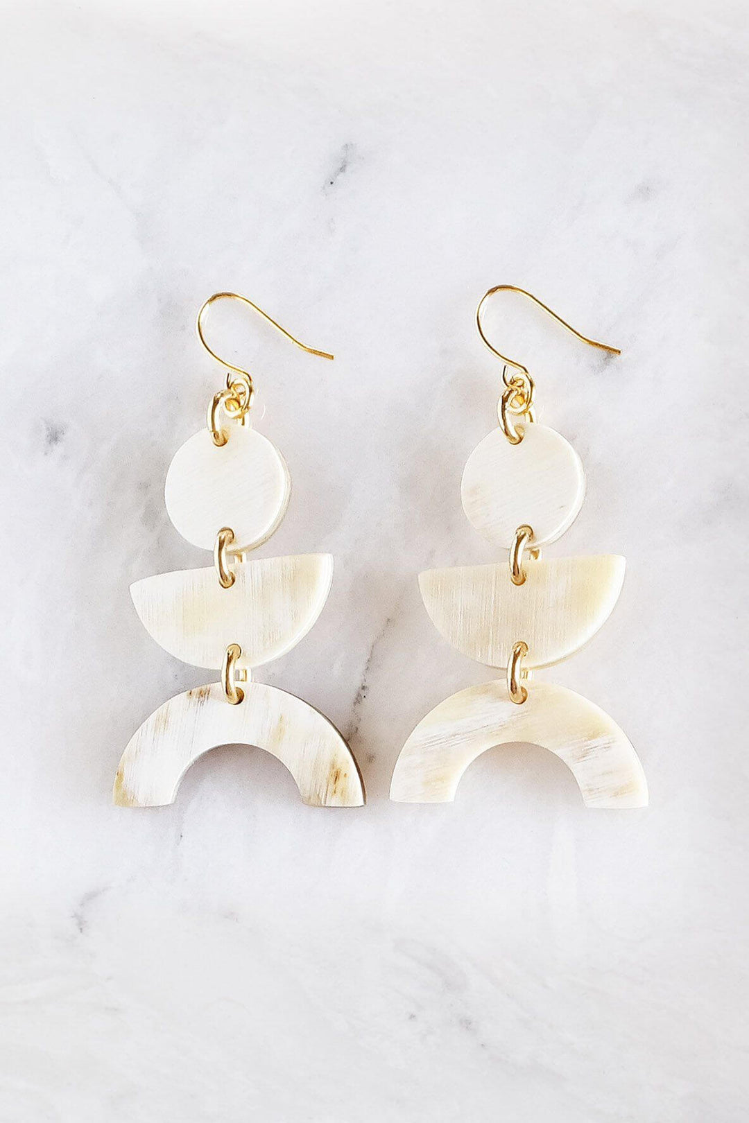 Handcrafted light horn geometric buffalo horn earrings with gold-plated hooks, natural design, assembled in California.