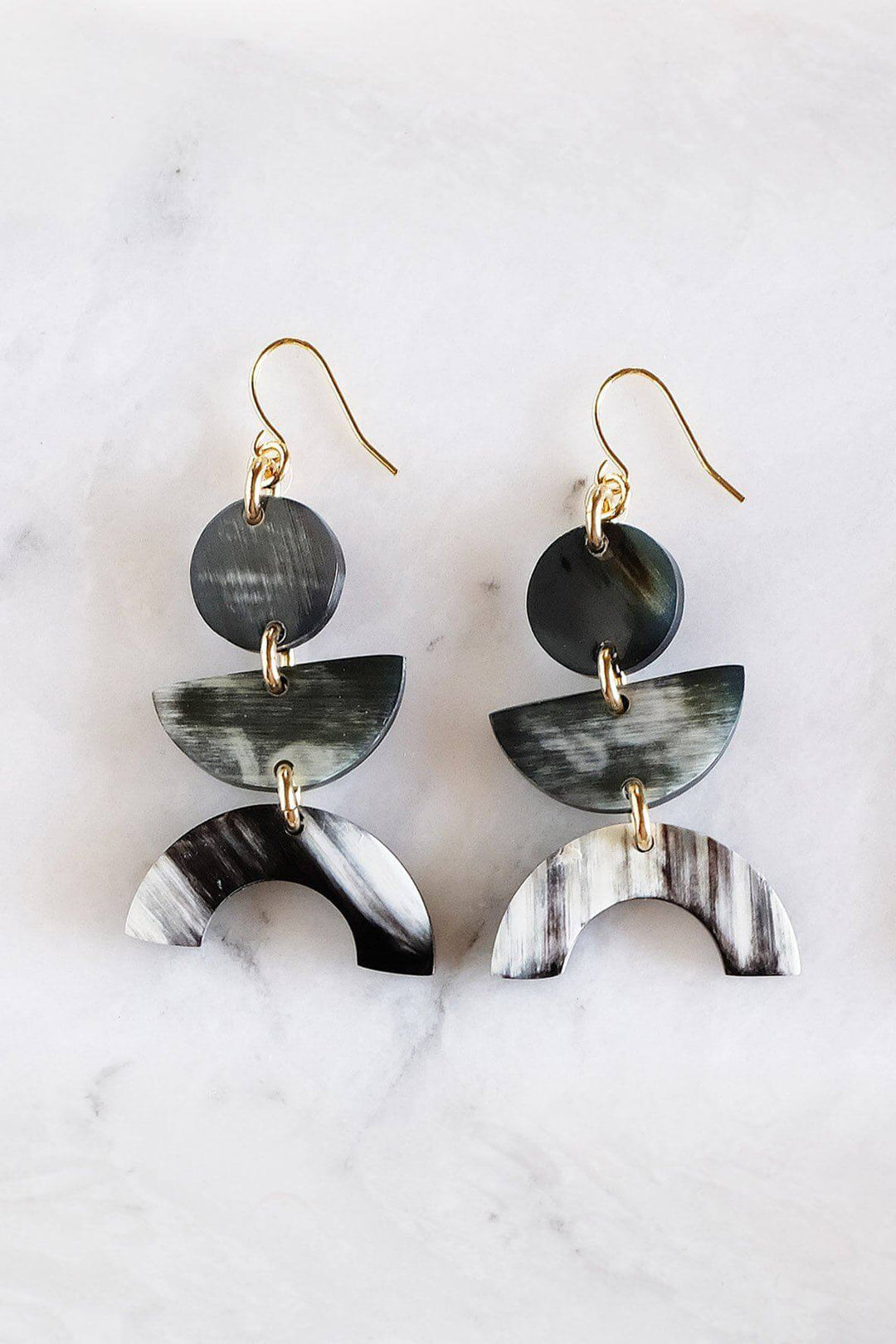 Geometric buffalo horn earrings in dark horn with gold-plated hooks, handcrafted and assembled in California. Natural, unique, and chemical-free.