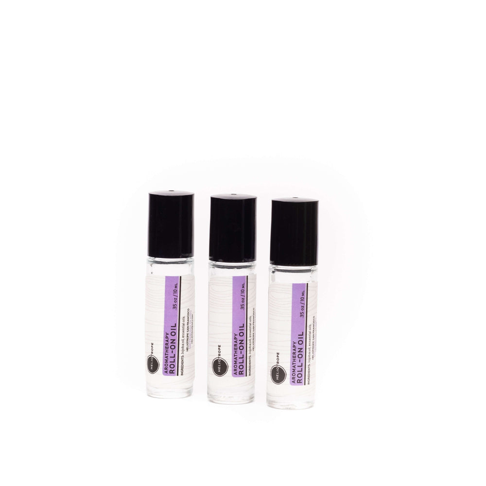 Three bottles of aromatherapy roll-on oil with pure essential oils in a skin-loving jojoba base, perfect for on-the-go relaxation.