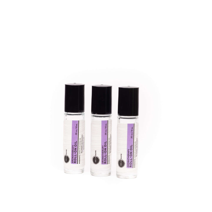 Three bottles of aromatherapy roll-on oil with pure essential oils in a skin-loving jojoba base, perfect for on-the-go relaxation.