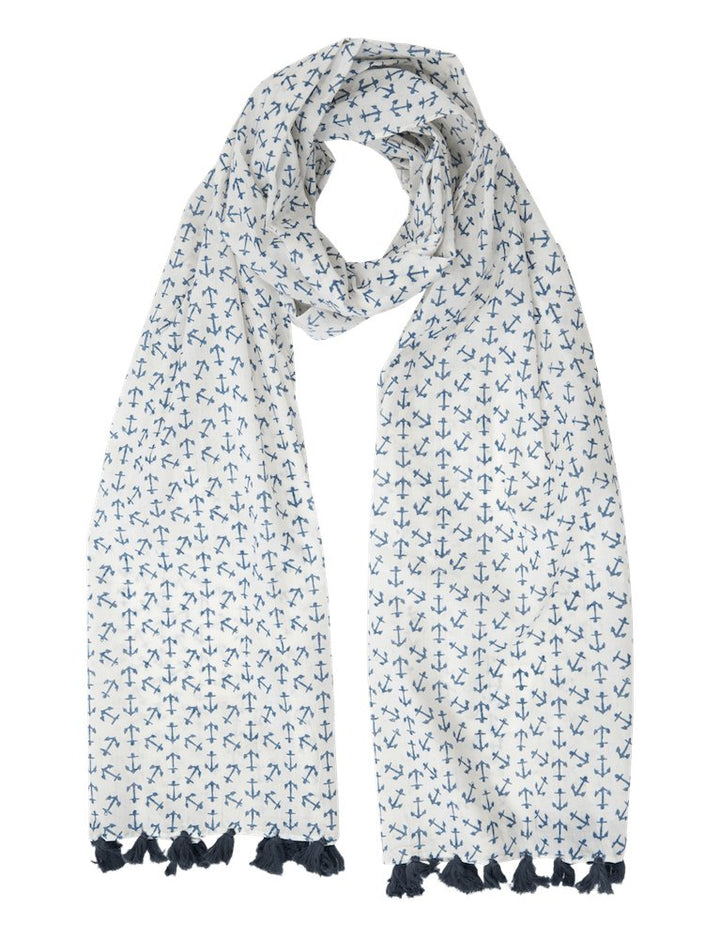 Blue cotton scarf with hand block printed anchor pattern and blue tassels laid flat
