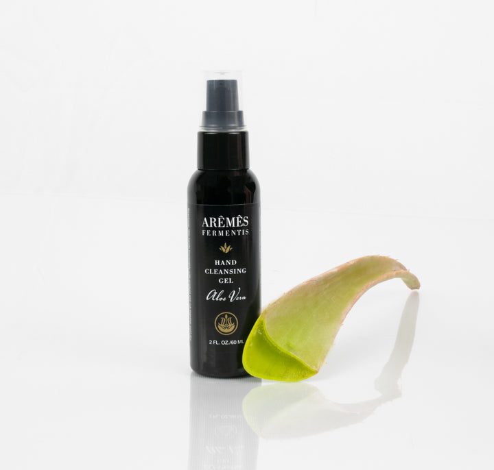 Aloe Vera Hand Cleansing Gel with aloe leaf, 2 oz, gentle, non-drying, lavender oil, Vitamin E, 62% alcohol for hygiene and hydration.