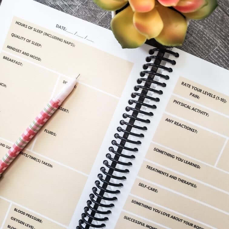 Spiral-bound Begin Within Eco-friendly Healing Journal with pen, featuring daily health prompts for tracking mood, nutrition, and more.