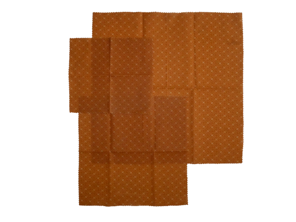 Set of three beeswax food wraps in the Orange Starts design in varying sizes..
