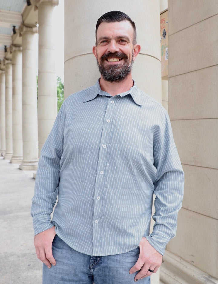Light blue and white handwoven cotton button down shirt with slim fit design displayed on neutral background