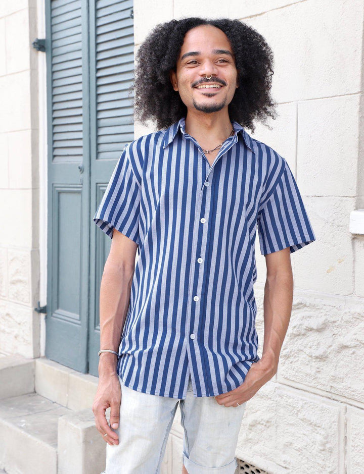 Blue striped organic cotton men's button down shirt with navy and grey stripes on white background