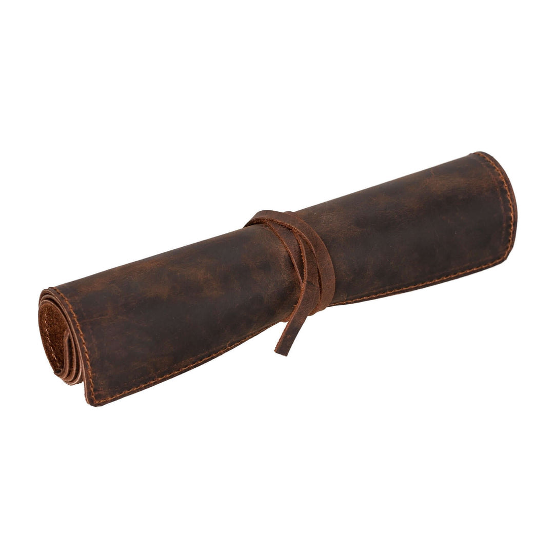 Broomfield handcrafted leather journal cover with strap, rolled and elegantly designed, perfect for notebooks.