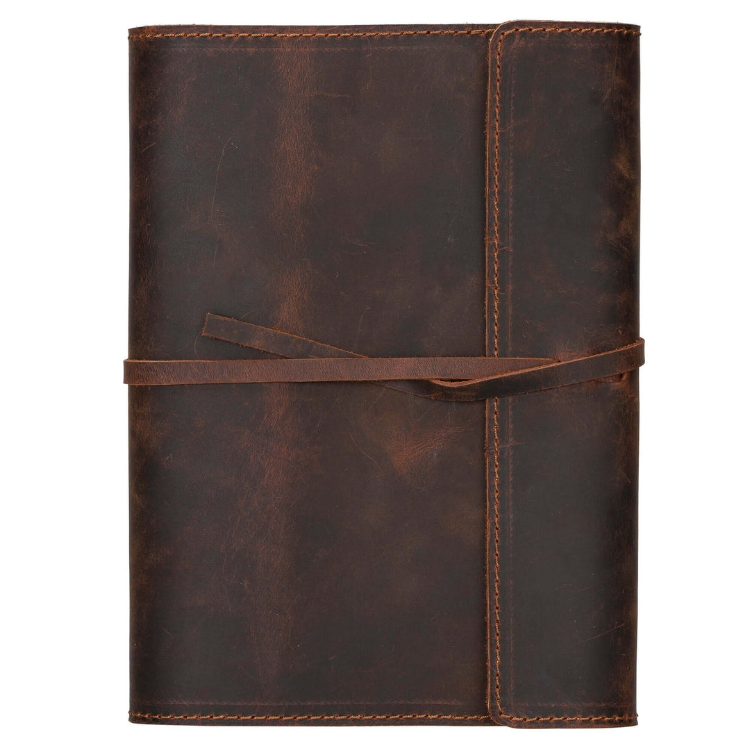 Broomfield handcrafted leather journal cover with strap from TORONATA, featuring aged leather and elegant design.
