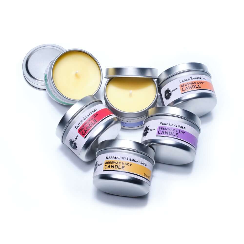 Beeswax & Soy Travel Candles in assorted scents, in 2oz tins, featuring pure essential oils, eco-friendly and long-lasting.