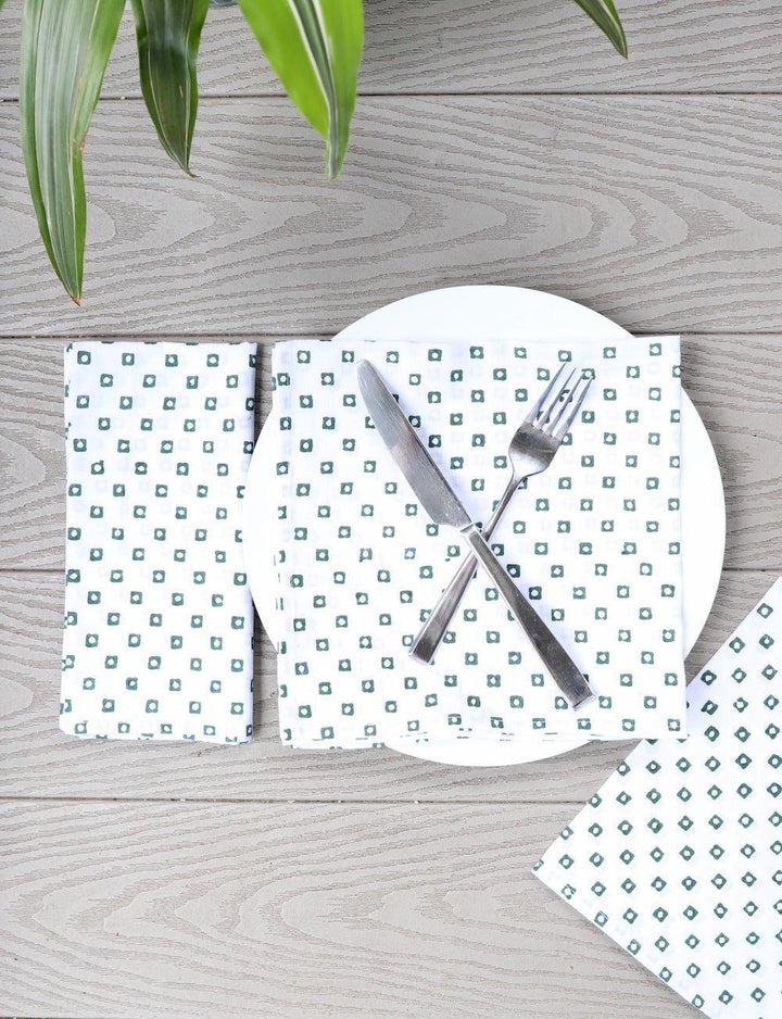 Green square print cloth napkins handmade from cotton with organic block printing set of four on white background