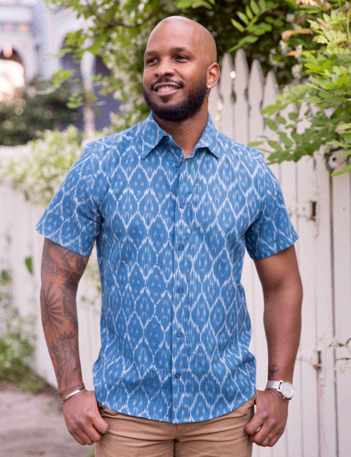Cobalt blue short sleeve button down shirt with ikat print pattern laid flat showing tailored fit and cotton fabric