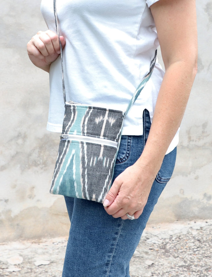 Handwoven zero waste crossbody bag with dual zippered pockets in naturally dyed cotton print