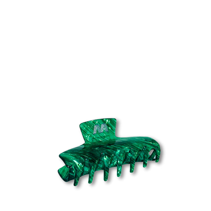 Large jade green hair claw clip made from cellulose acetate with aluminum accents on white background