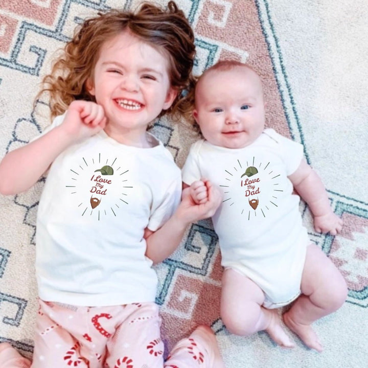 Organic cotton toddler tee with I love dad beard graphic design in soft natural colors