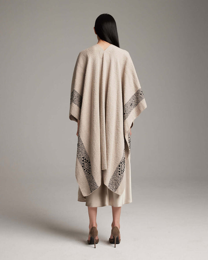Back view of the Long Estrella Textured Cotton Duster, handcrafted with organic Pima cotton, featuring Mapuche design, worn by a model.