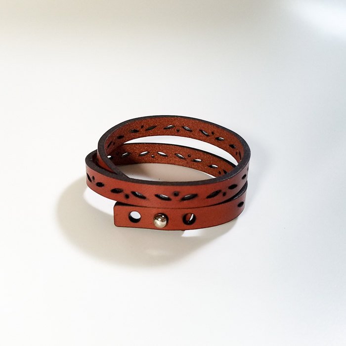 Leather double wrap bracelet with sun and moon laser cut designs, 0.4" wide, adjustable button closure, suitable for wrist sizes S, M, L.