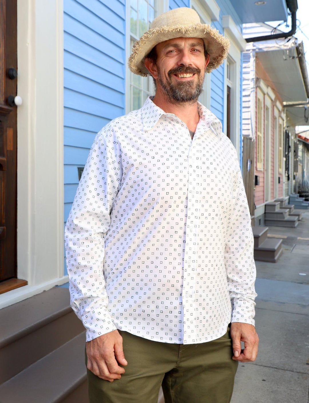 Green and white organic cotton button down shirt with handwoven ikat pattern and long sleeves