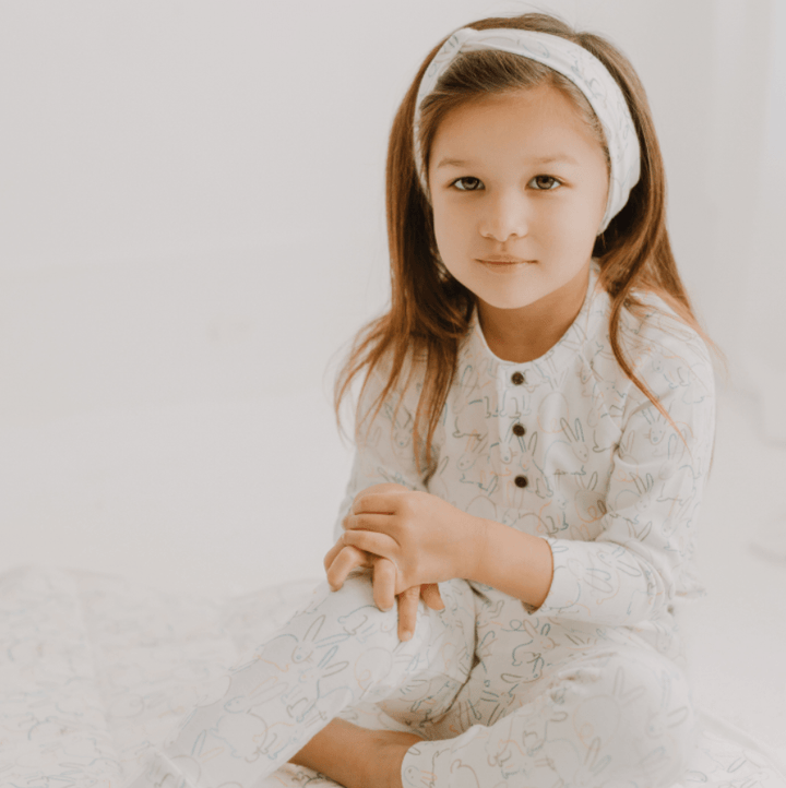 Organic cotton long sleeve henley with whimsical bunny print and natural coconut snaps for children