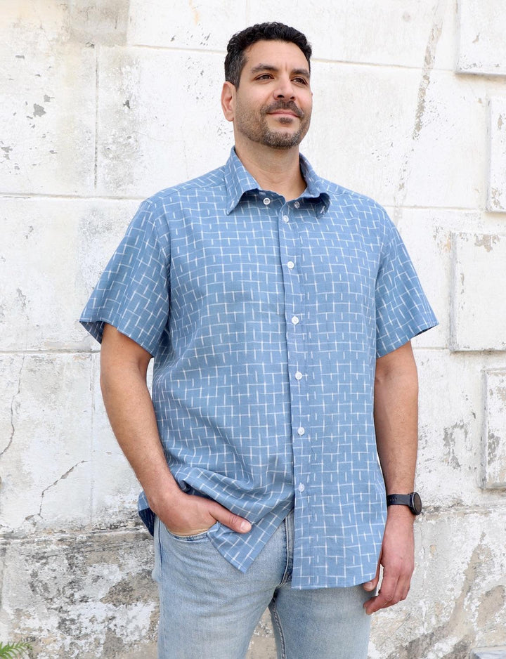 Blue and white striped organic cotton button down shirt with handwoven ikat pattern and short sleeves