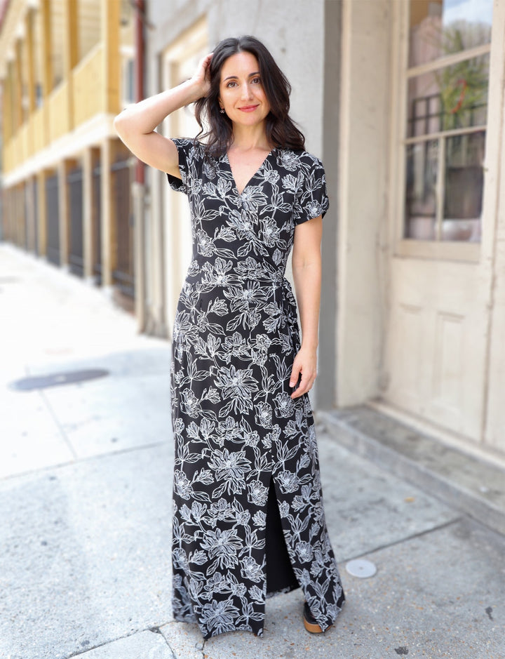 Black and white organic modal maxi dress with botanical print and short sleeves on model