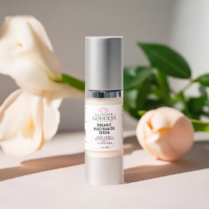 Organic Niacinamide Anti Aging Serum bottle with rose and soft lighting background.