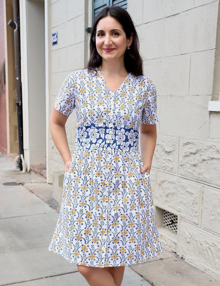 Retro floral organic cotton button dress with yellow blue flowers white background v-neck pockets vintage style