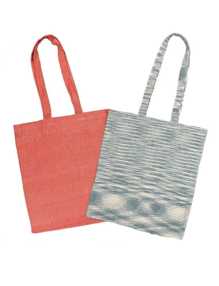 Handwoven cotton tote bag with colorful ikat print and long handles for grocery shopping and daily errands