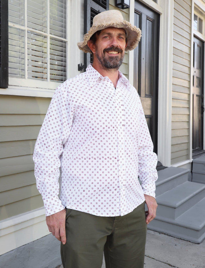 Red and white checkered organic cotton button down shirt with hand block printed square pattern on white background