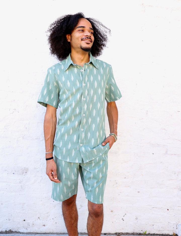 Sage green mens button down shirt with short sleeves handwoven cotton ikat fabric displayed on model
