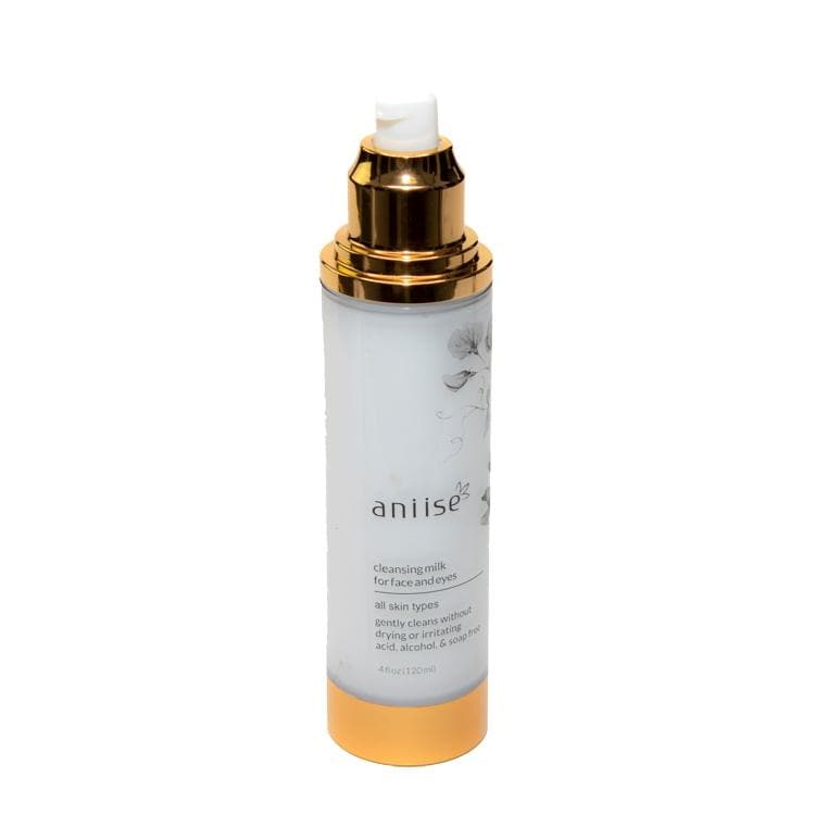 Cleansing Milk for Face and Neck by Aniise, suitable for all skin types, in a white bottle with a gold cap, 4 oz size.
