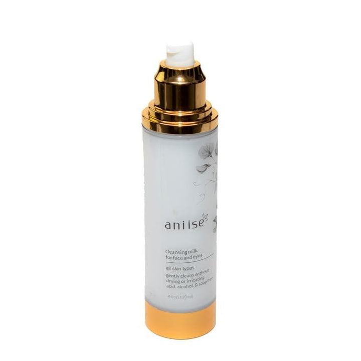 Cleansing Milk for Face and Neck by Aniise, suitable for all skin types, in a white bottle with a gold cap, 4 oz size.